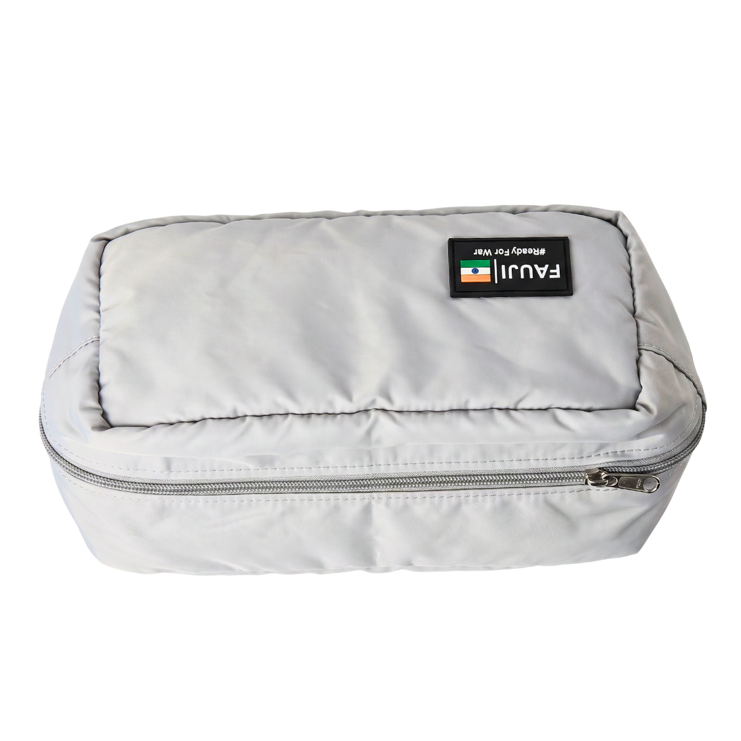 Gray toiletry bag with a visible brand label on a white background