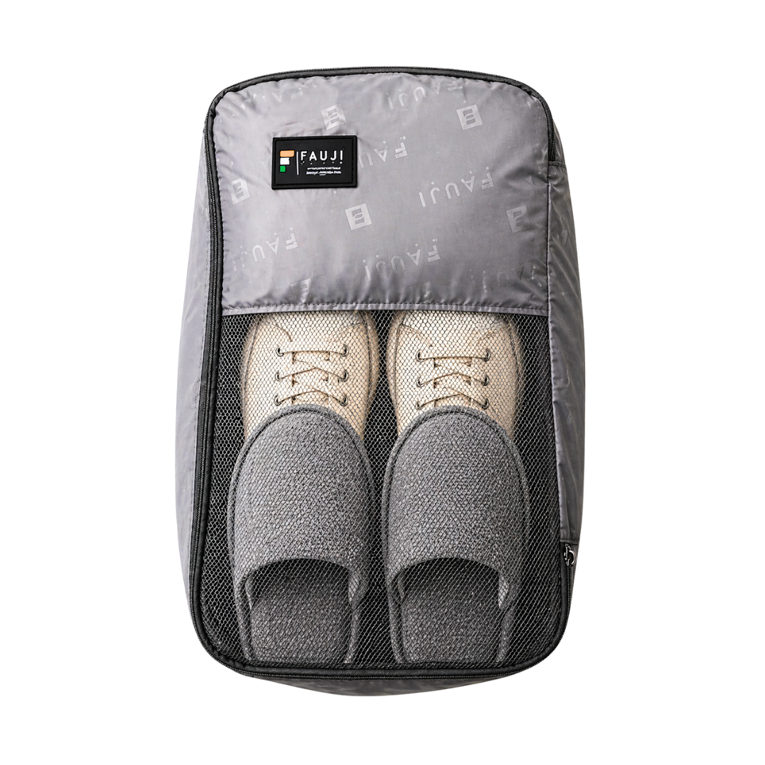 Gray shoe organizer with two pairs of shoes inside on a white background
